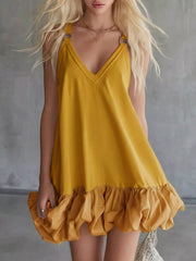 Yellow V-neck mini dress with bubble hem and ruffled detail.