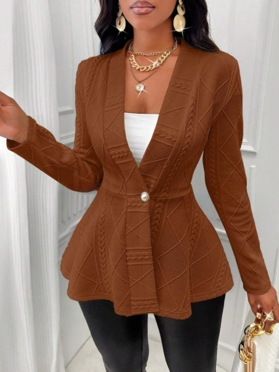 Textured knit peplum blazer in dark brown with a single button closure and a flared hem.
