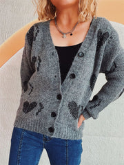 Dark gray knit cardigan with black heart motif, button front, and V-neck.
