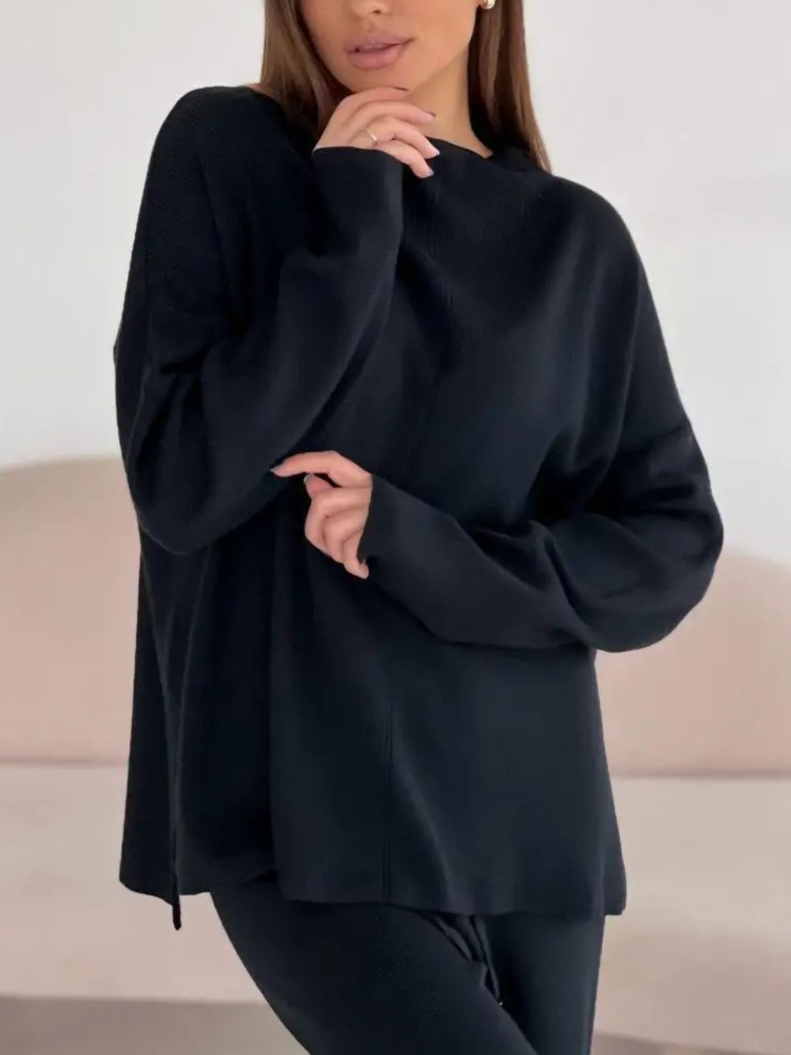 Black relaxed fit knit co-ord set with crew neck and long sleeves.