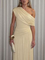 Elegant beige one-shoulder maxi dress with draped bodice and ruched waist.