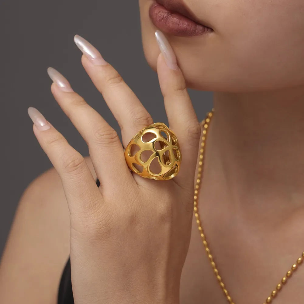 Gold openwork orb ring with a contemporary, casual style.