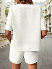 White waffle knit drawstring co-ord set with short sleeves and shorts.