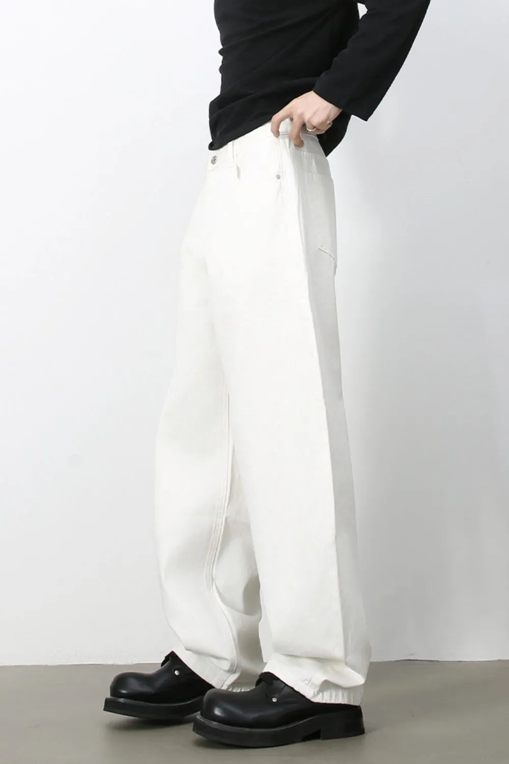 Sculpted ivory denim balloon trousers with a relaxed fit and casual styling.