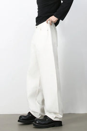 Sculpted ivory denim balloon trousers with a relaxed fit and casual styling.