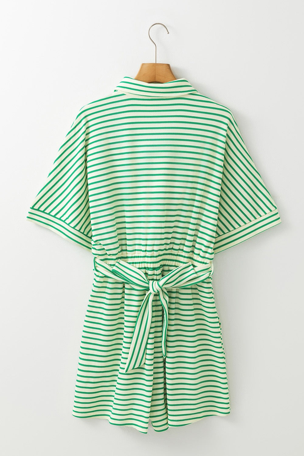 Green striped resort shirt romper with tie waist and short sleeves.