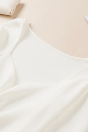 Ivory ribbed knit sweater with ruched front detail