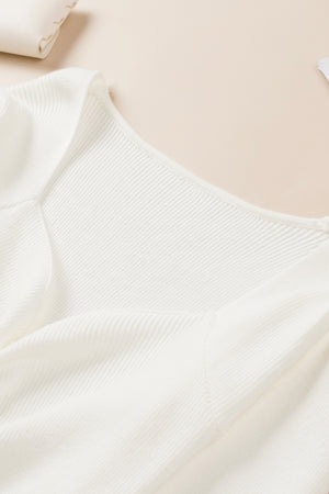 Ivory ribbed knit sweater with ruched front detail