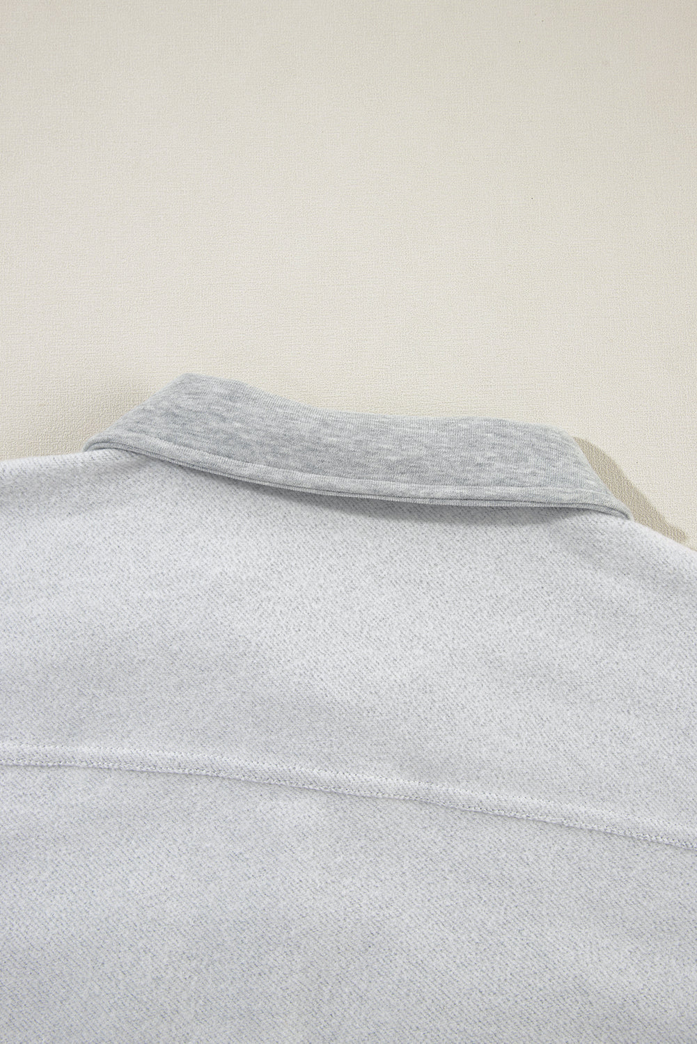 Light gray cotton utility vest with contrast collar detail