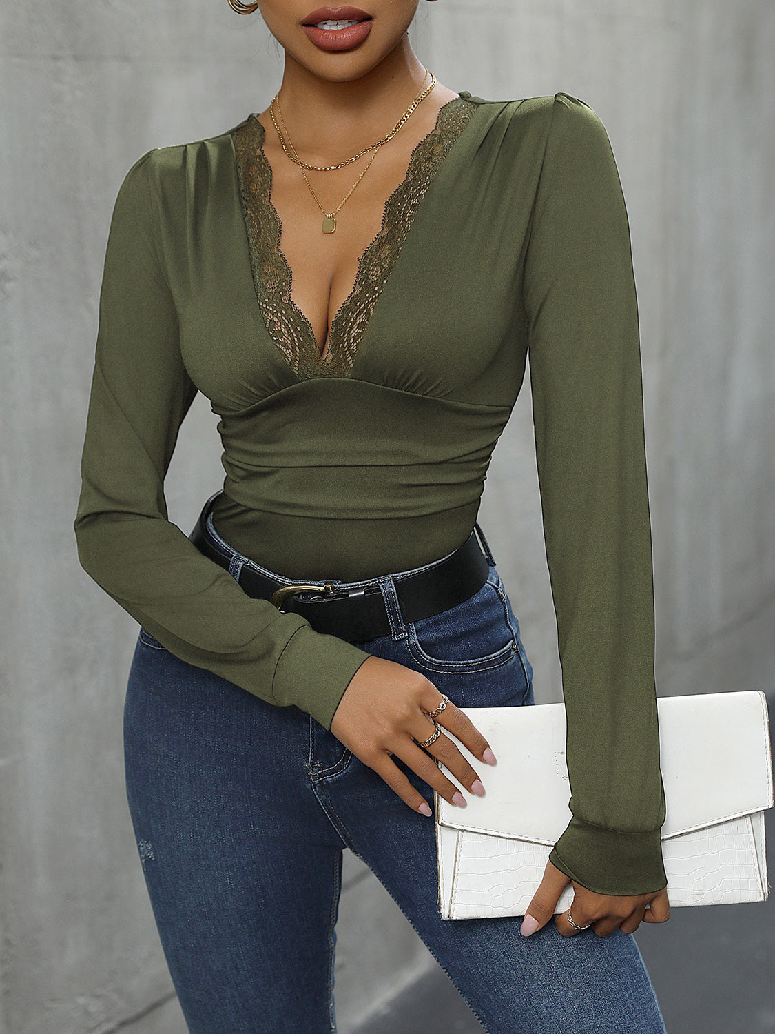 Long sleeve bodysuit in Matcha Green with lace trim V-neckline.