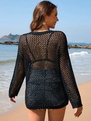 Black open-knit beach sweater with ribbed trim and long sleeves.