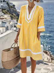 Yellow and white striped V-neck dress with pockets and contrast trim