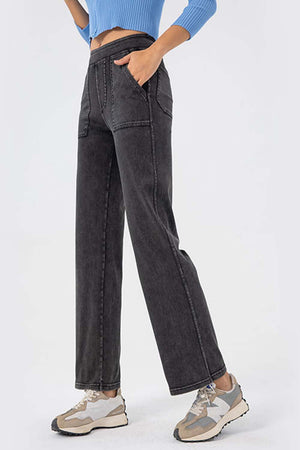 Gray denim straight leg pants with utility pockets and elastic waistband.