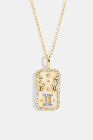 Gemini zodiac sign pendant necklace with blue crystals and gold-plated chain.