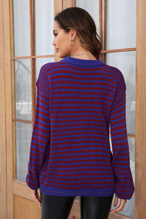 Classic Breton stripe knit crewneck sweater in dark blue and burgundy acrylic with crew neck.