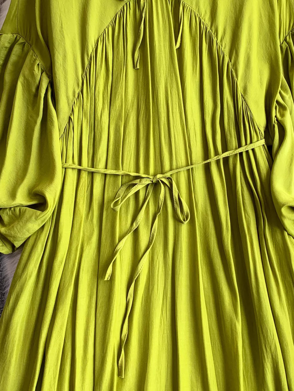 Light green polyester maxi dress with balloon sleeves, drawstring waist, and ruched neckline detail.