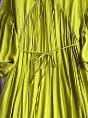 Light green polyester maxi dress with balloon sleeves, drawstring waist, and ruched neckline detail.