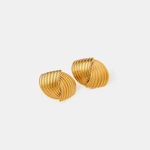 Gold coil earrings with a sculpted, ribbed design.