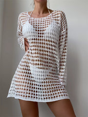 White crochet knit cover-up with openwork pattern and long sleeves.