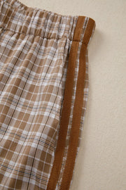 Plaid drawstring casual pants in camel with brown chevron stripe detail on the side.