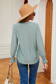 Lace-trimmed eyelet blouse in Gum Leaf with ruffle cuffs and long sleeves.