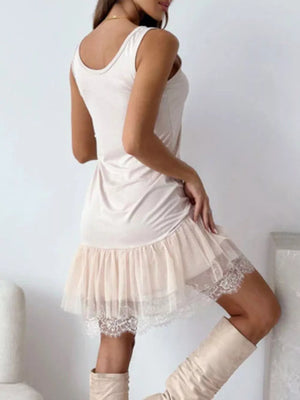 Apricot slip dress with lace-trimmed tulle hem and scoop neck.