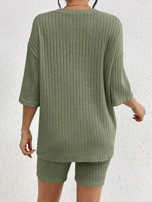 Sage ribbed loungewear set with relaxed fit top and biker shorts.