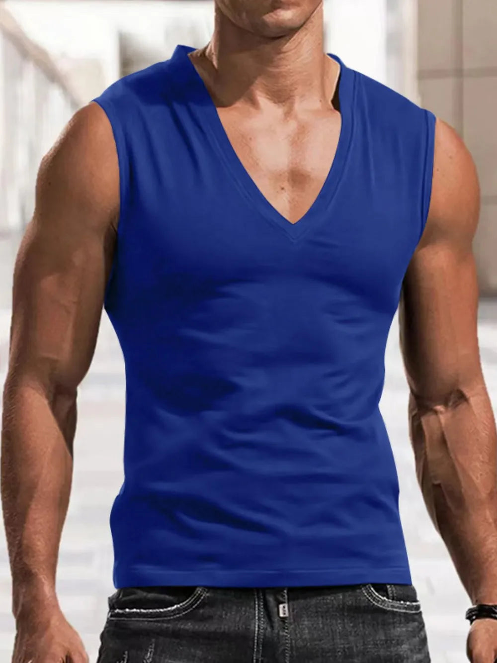 Sculpted V-neck muscle tank top in royal blue, sleeveless, form-fitting activewear.