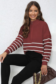 Burgundy ribbed knit quarter-zip sweater with white stripes on sleeves and body.
