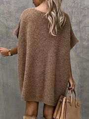 Mocha knit cocoon dress with short sleeves and a relaxed fit, styled with a handbag.