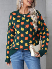 Dark Green knit crewneck sweater with all-over orange and yellow leaf pattern.