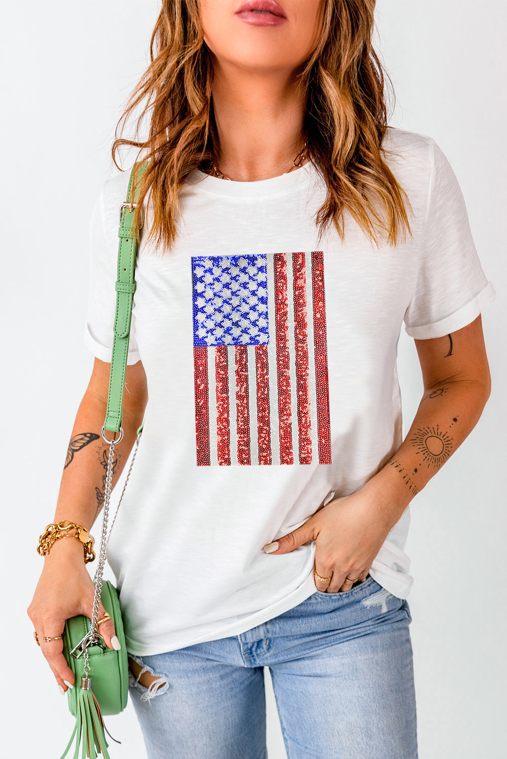 White t-shirt with sequin American flag graphic, crew neck, short sleeves.
