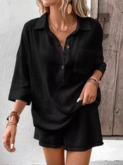 Black cotton two-piece set with button-up shirt and shorts.