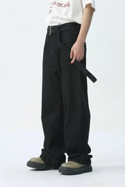 Black wide-leg denim jeans with a belted detail and a casual fit.