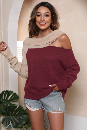 Asymmetric shoulder block sweater in deep red and beige acrylic with boat neck.