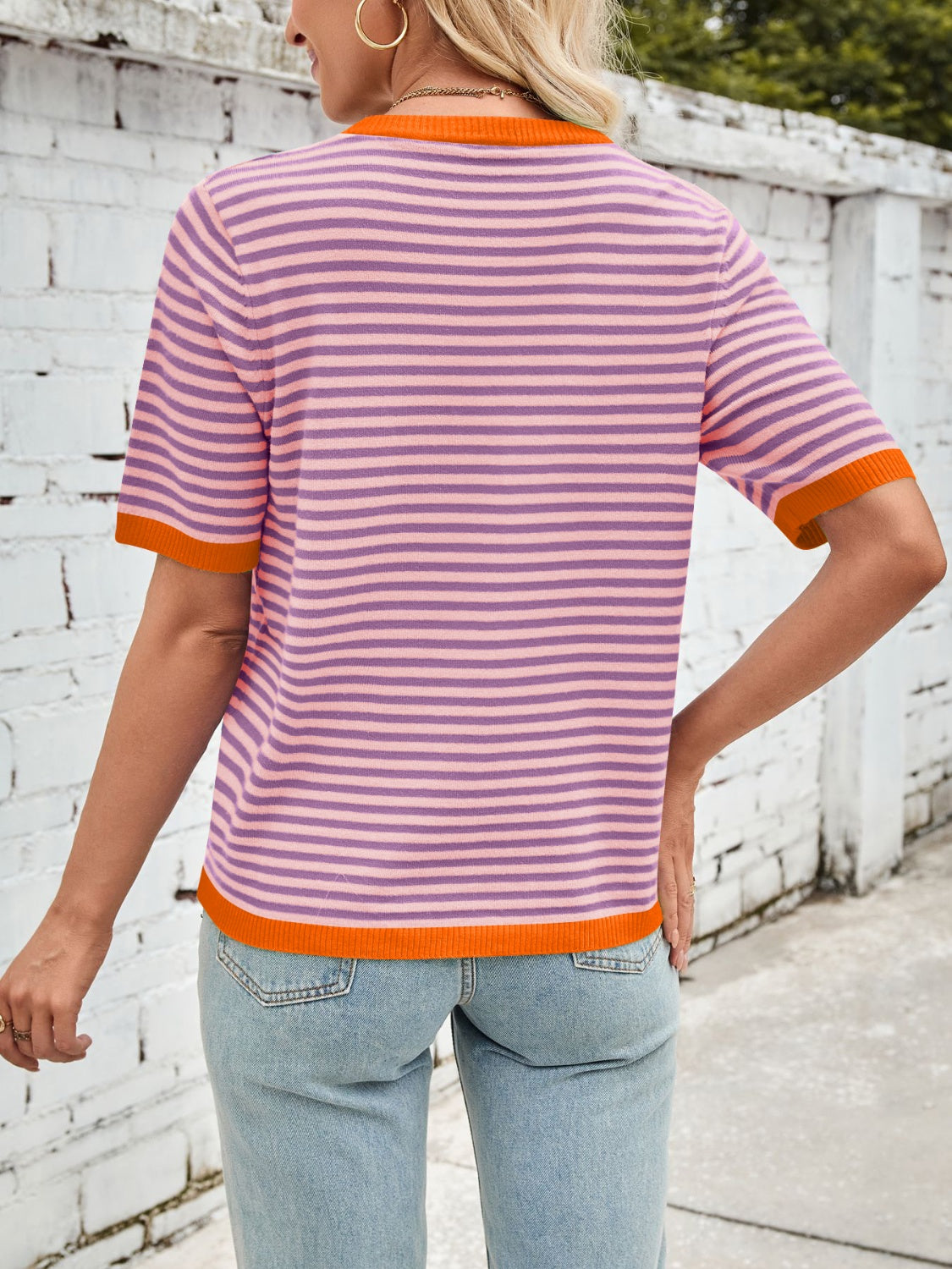 Striped knit tee with orange trim and crew neck.