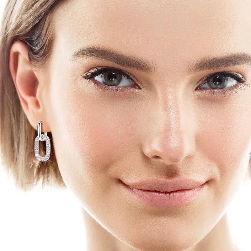 Silver pave oval link drop earrings with a polished finish.
