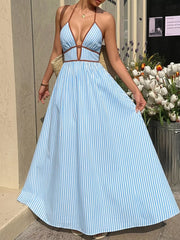 Blue striped halter maxi dress with brown trim and a-line skirt.