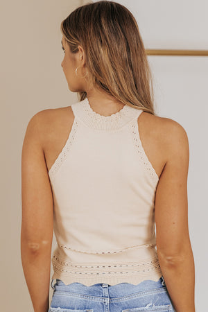 Eggshell knit halter top with scalloped neckline and hem detail