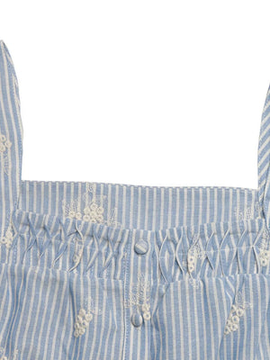 Blue and white striped peplum shirt with smocking and embroidered floral details.