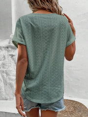Sage eyelet v-neck tunic top with short sleeves and a relaxed fit.