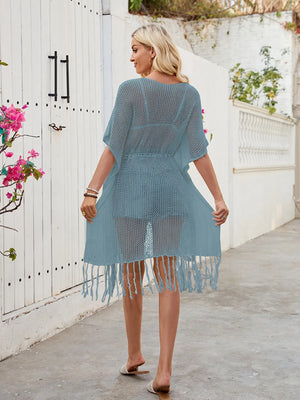 Peacock blue open-knit cover-up with drawstring waist and fringe hem.