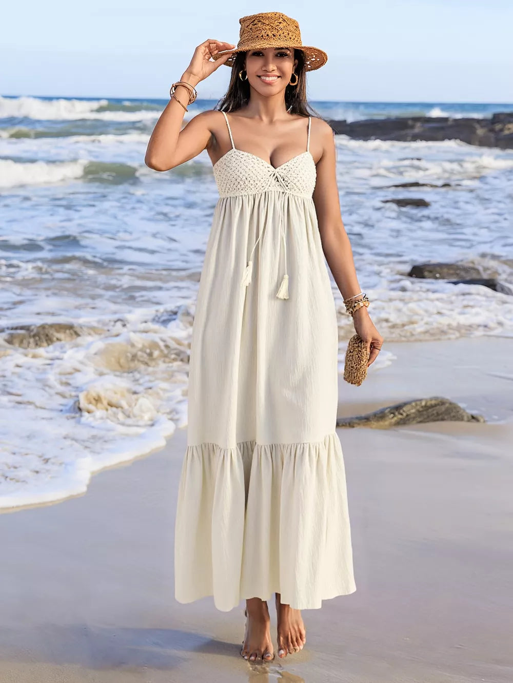 Cream ruched sweetheart neck maxi dress with crochet bodice and tassel tie.