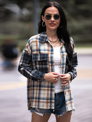 Colorblock plaid utility shacket in navy with button front and chest pockets.