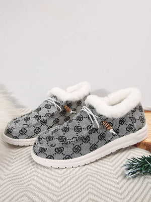 Southwestern print faux fur lined loafers in gray with white laces and wooden toggles.