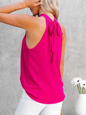 Keyhole halterneck top in fuchsia pink with a tie-back detail.