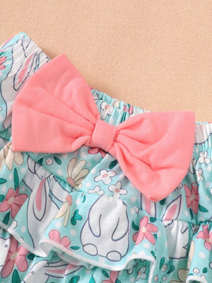 Ruffled baby bodysuit and skirt set with bunny and floral print, featuring a pink bow.
