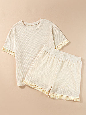 Cream waffle knit set with fringe trim on t-shirt sleeves and shorts hem.