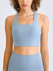 Light blue sculpted racerback crop top with a scoop neckline and wide band.