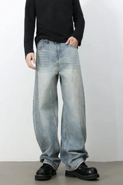 Faded baggy denim jeans in light blue with a relaxed fit.